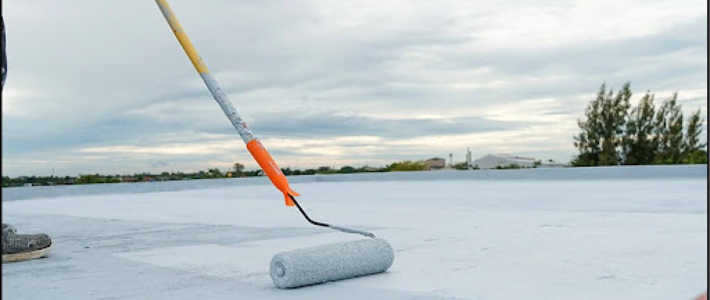 Worker applying VURA waterproofing solution to protect a building from water leakage and moisture damage.