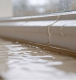VURA waterproofing solution applied on a terrace roof to protect the building from monsoon water leakage.