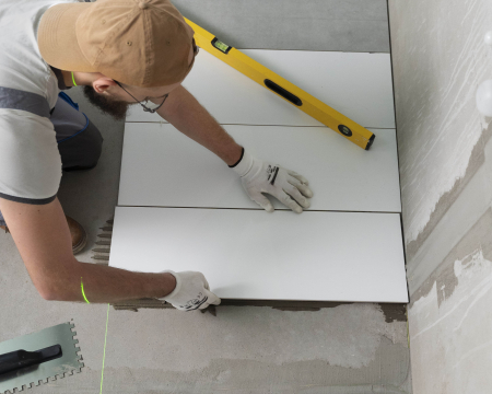 Waterproof tile adhesive application for swimming pool and bathroom tiles